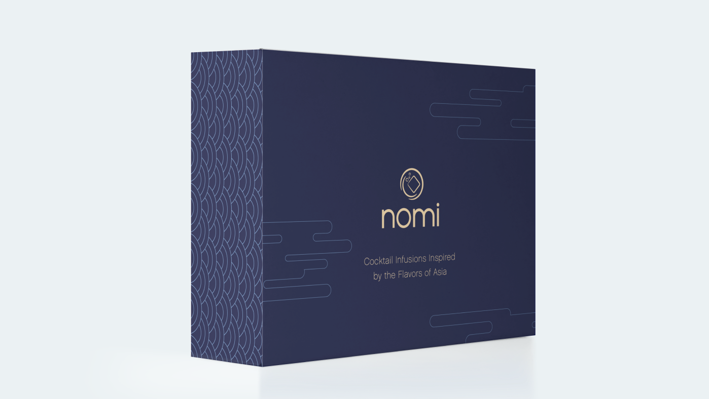 Nomi Cocktails packaging, showing a navy blue box with a gold logo on the front